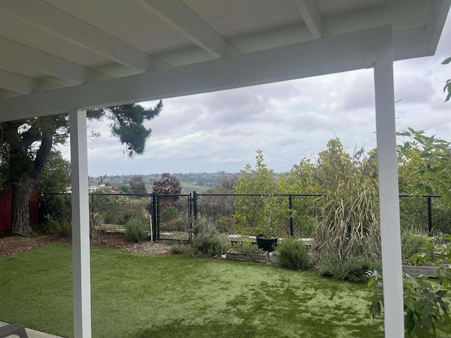 view of yard with a gate