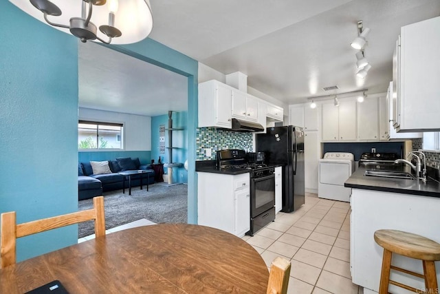 3113 Buena Hills Dr, Oceanside, CA 92056 - kitchen with black appliances, a sink, dark countertops, white cabinetry, and tasteful backsplash