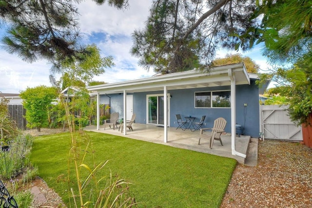 3113 Buena Hills Dr, Oceanside, CA 92056 - rear view of house with stucco siding, a patio area, and a gate