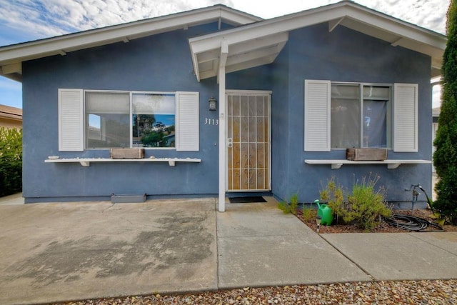 3113 Buena Hills Dr, Oceanside, CA 92056 - view of front of home featuring a patio area and stucco siding