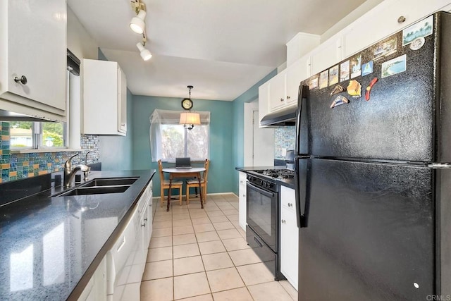 3113 Buena Hills Dr, Oceanside, CA 92056 - kitchen with black appliances, under cabinet range hood, white cabinetry, light tile patterned floors, and a sink
