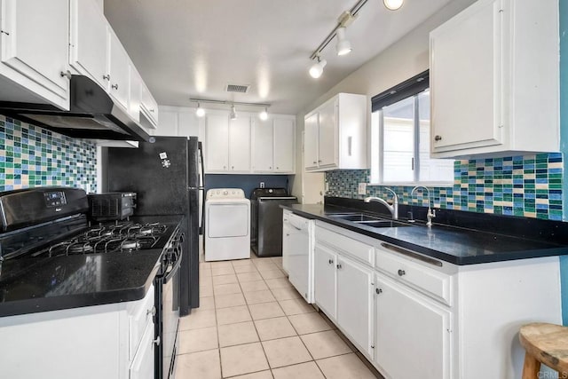 3113 Buena Hills Dr, Oceanside, CA 92056 - kitchen featuring gas stove, washing machine and dryer, a sink, under cabinet range hood, and rail lighting