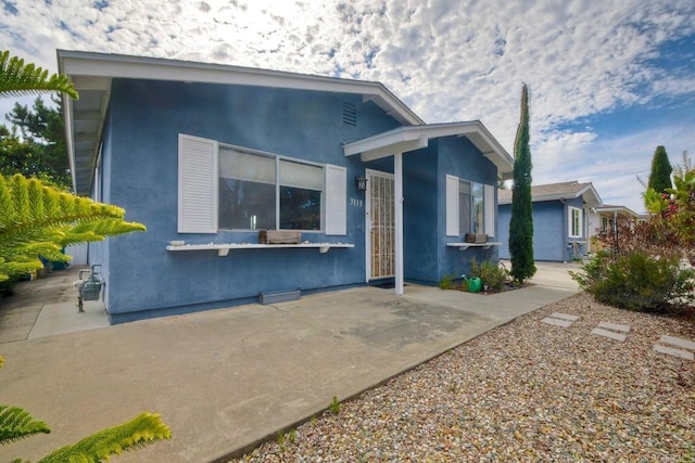 3113 Buena Hills Dr, Oceanside, CA 92056 - view of front facade featuring a patio area and stucco siding