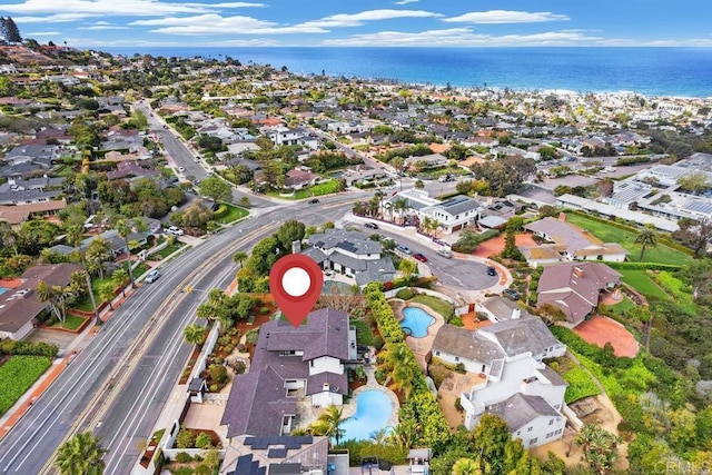 view of property location featuring nearby suburban area, a pool area, a large body of water, and a highway