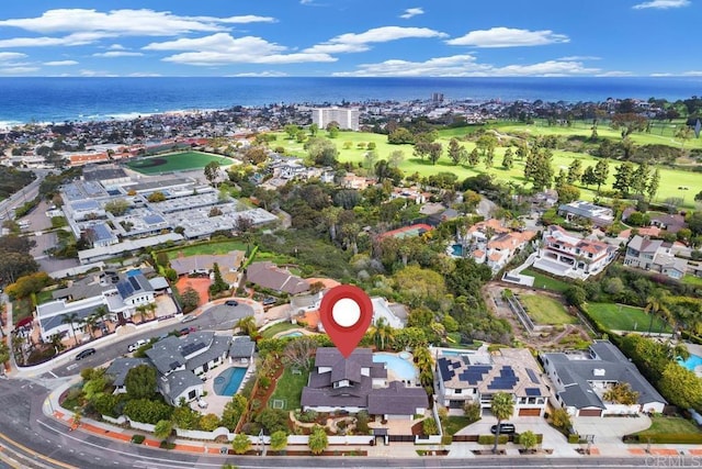view of property location featuring a nearby body of water and nearby suburban area