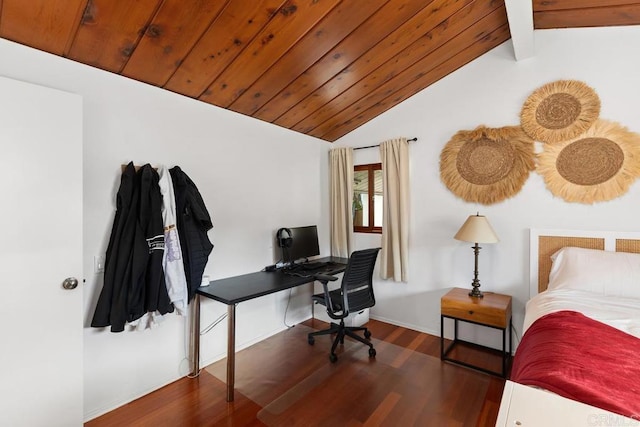 bedroom featuring wood finished floors, an office area, and baseboards