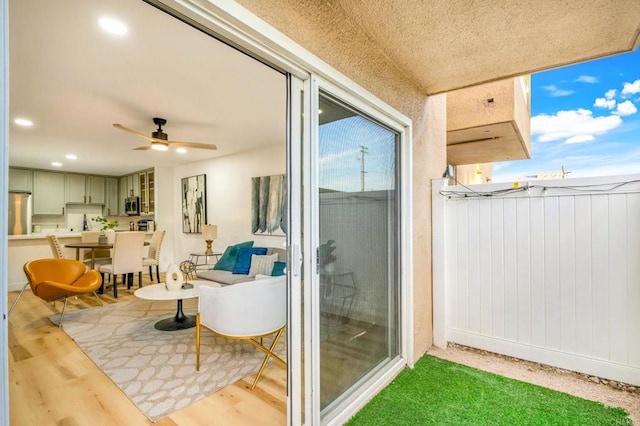 balcony with a ceiling fan and outdoor dining area