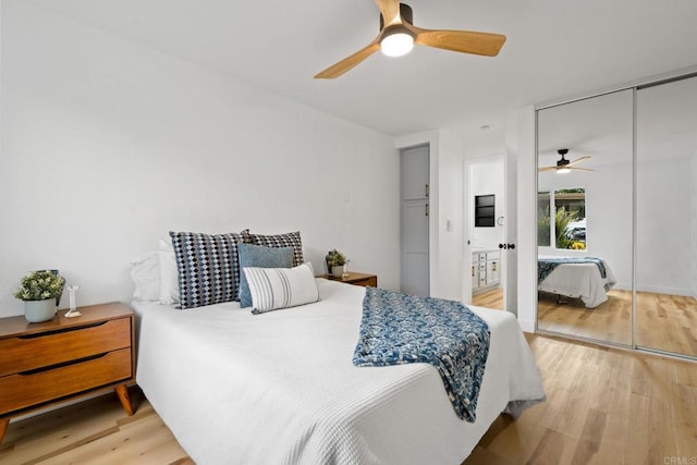 bedroom featuring light wood-style flooring, a closet, and a ceiling fan