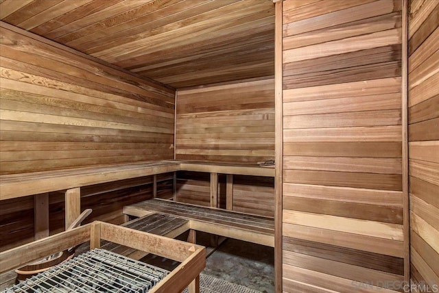 sauna with wooden walls and wooden ceiling