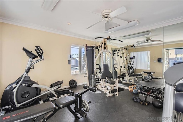 exercise room with a ceiling fan, crown molding, plenty of natural light, and baseboards