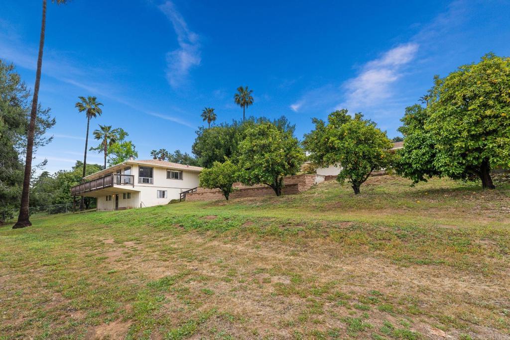 27229 Oakmont, Valley Center, CA 92082 - view of grassy yard with a wooden deck
