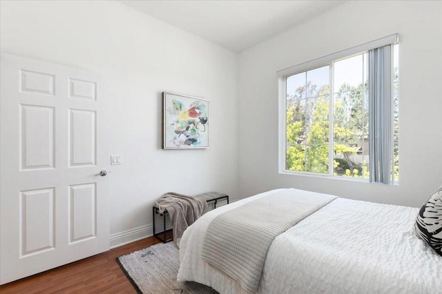 12370 Carmel Country Rd Unit 305, San Diego, CA 92130 - bedroom with multiple windows, dark wood-type flooring, and baseboards