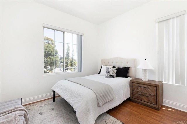12370 Carmel Country Rd Unit 305, San Diego, CA 92130 - bedroom with baseboards and wood finished floors