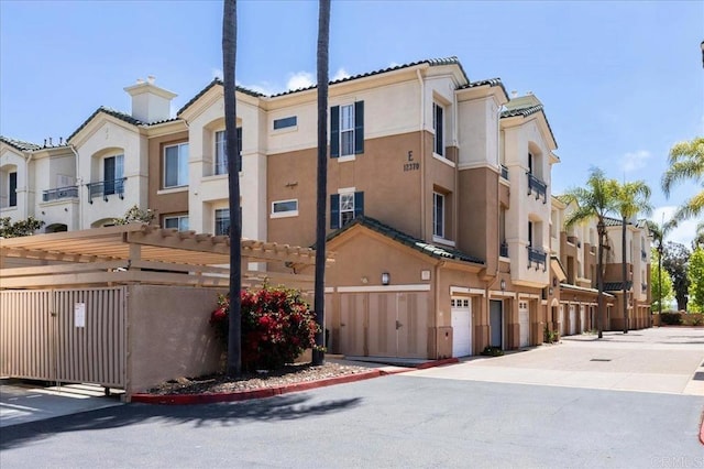12370 Carmel Country Rd Unit 305, San Diego, CA 92130 - view of property featuring a residential view and an attached garage