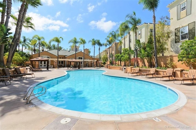 12370 Carmel Country Rd Unit 305, San Diego, CA 92130 - community pool featuring a patio area and french doors