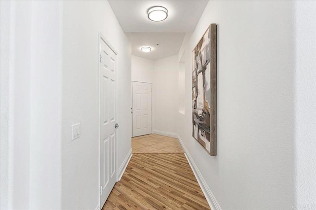 12370 Carmel Country Rd Unit 305, San Diego, CA 92130 - hall with light wood-style floors and baseboards
