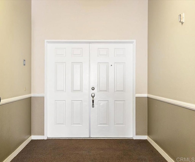 12370 Carmel Country Rd Unit 305, San Diego, CA 92130 - foyer featuring dark carpet and baseboards