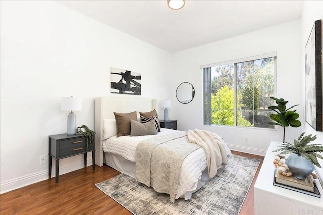 12370 Carmel Country Rd Unit 305, San Diego, CA 92130 - bedroom with baseboards and wood finished floors
