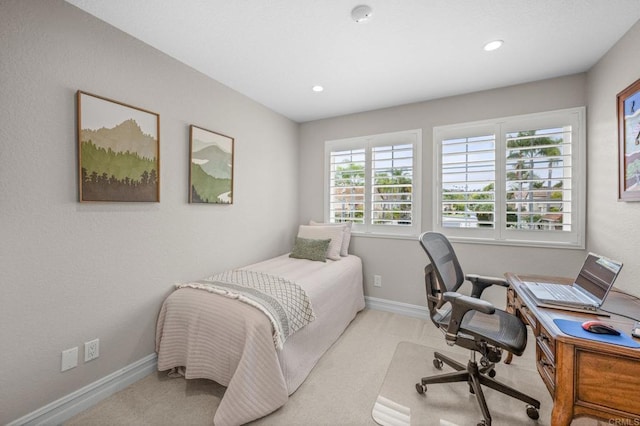 bedroom with light carpet, baseboards, a desk, and recessed lighting