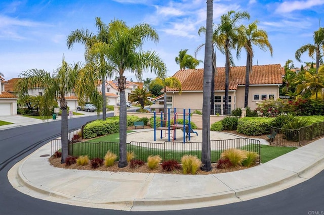 view of community featuring fence