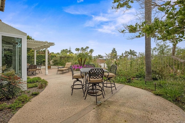 view of patio / terrace featuring a pergola, outdoor dining space, and fence
