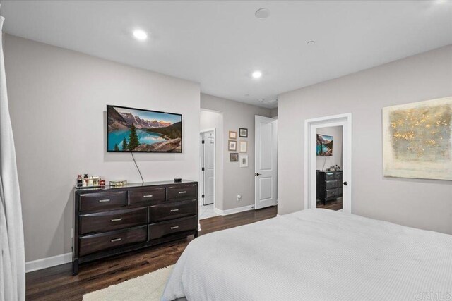 1840 Mint Unit 6, Chula Vista, CA 91915 - bedroom with dark wood-style floors, recessed lighting, and a walk in closet