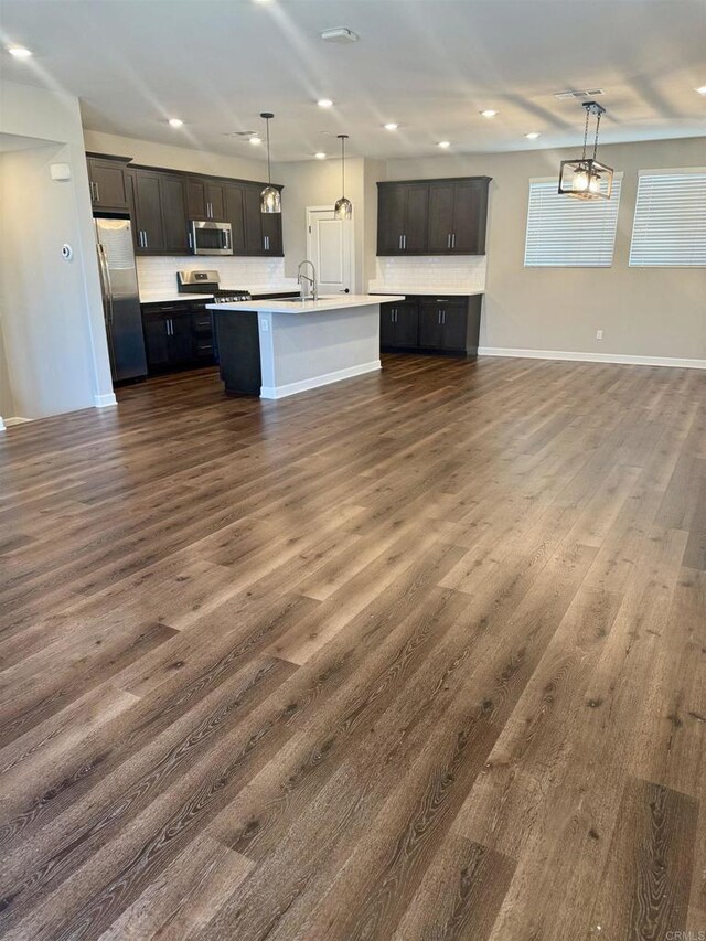 1840 Mint Unit 6, Chula Vista, CA 91915 - kitchen featuring stainless steel appliances, open floor plan, decorative backsplash, light countertops, and recessed lighting