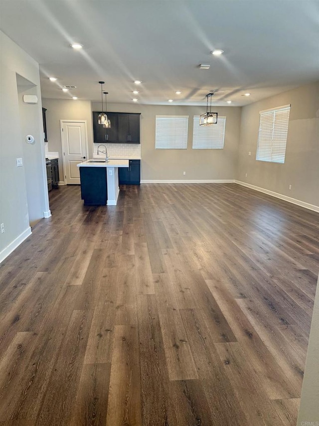 1840 Mint Unit 6, Chula Vista, CA 91915 - unfurnished living room with dark wood-type flooring, recessed lighting, and plenty of natural light