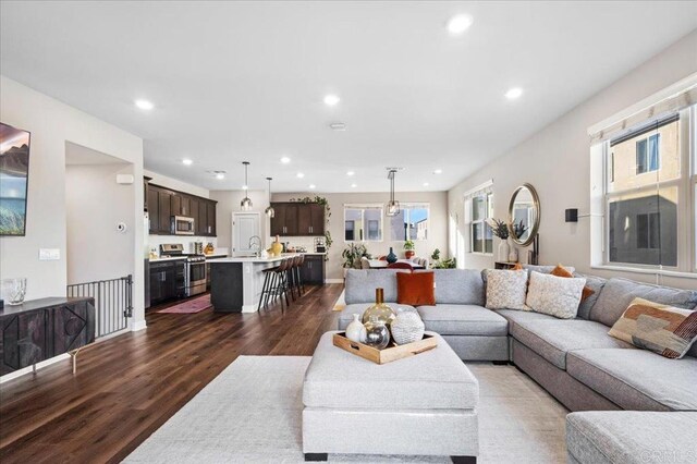 1840 Mint Unit 6, Chula Vista, CA 91915 - living room with dark wood finished floors, recessed lighting, and plenty of natural light
