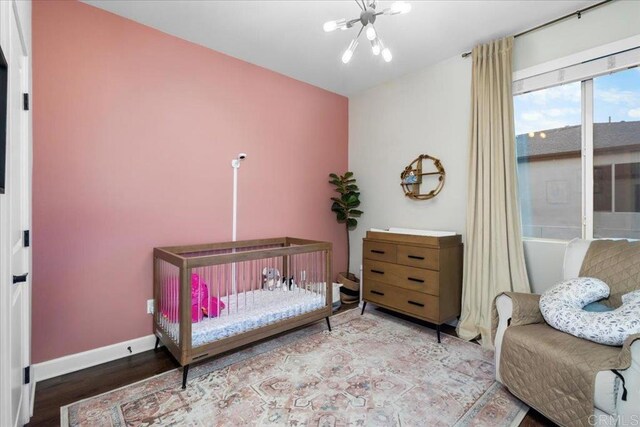 1840 Mint Unit 6, Chula Vista, CA 91915 - bedroom featuring wood finished floors and a chandelier
