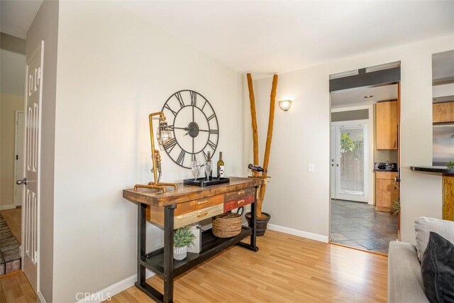 24111 Marathon St, Mission Viejo, CA 92691 - corridor with baseboards and light wood-type flooring