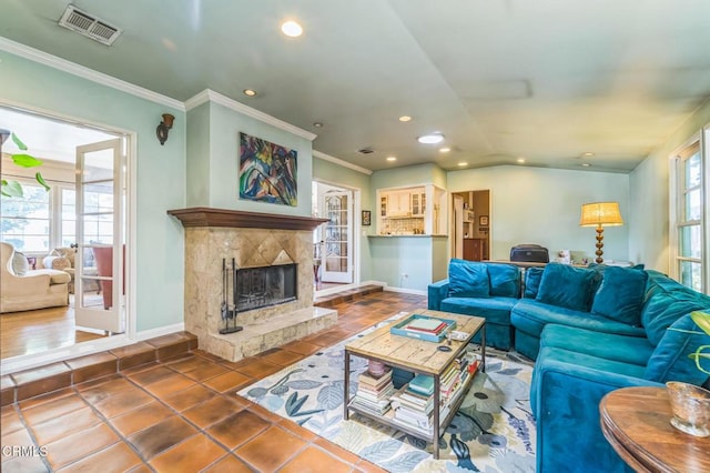 tiled living room featuring recessed lighting, baseboards, a premium fireplace, and crown molding