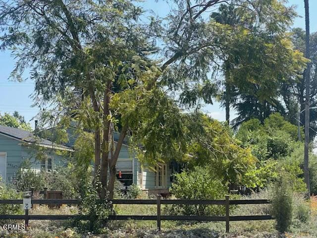 view of home's exterior featuring a fenced front yard and a garage