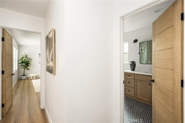 2153 Stanbridge Ave, Long Beach, CA 90815 - hallway with light wood finished floors and baseboards