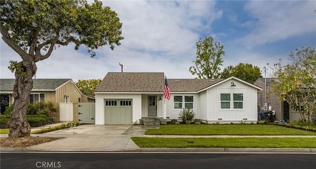 2153 Stanbridge Ave, Long Beach, CA 90815 - ranch-style home featuring a garage, driveway, a gate, and board and batten siding
