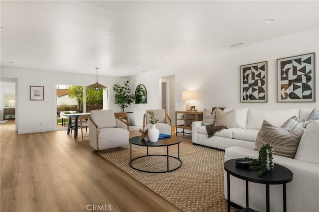 2153 Stanbridge Ave, Long Beach, CA 90815 - living room featuring light wood-type flooring and baseboards