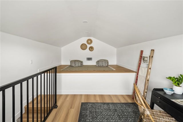 2153 Stanbridge Ave, Long Beach, CA 90815 - additional living space with wood finished floors, vaulted ceiling, and baseboards