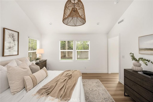 2153 Stanbridge Ave, Long Beach, CA 90815 - bedroom with wood finished floors, high vaulted ceiling, and baseboards