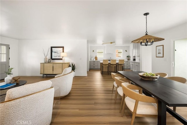 2153 Stanbridge Ave, Long Beach, CA 90815 - dining area with plenty of natural light, wood finished floors, and baseboards