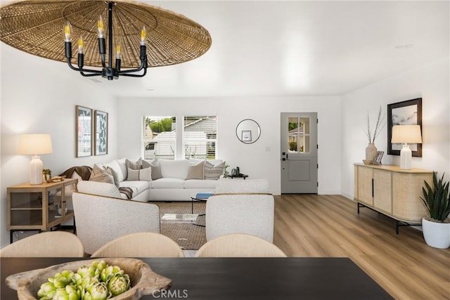 2153 Stanbridge Ave, Long Beach, CA 90815 - living area with light wood-style flooring, a chandelier, and baseboards