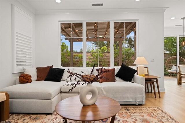 54 Painted Cameo, Irvine, CA 92602 - living area featuring light wood-style flooring, recessed lighting, and ornamental molding