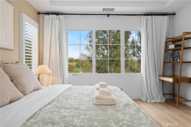 54 Painted Cameo, Irvine, CA 92602 - bedroom featuring multiple windows, wood finished floors, and baseboards