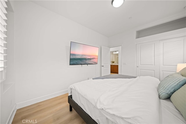 54 Painted Cameo, Irvine, CA 92602 - bedroom with baseboards, a closet, and light wood finished floors