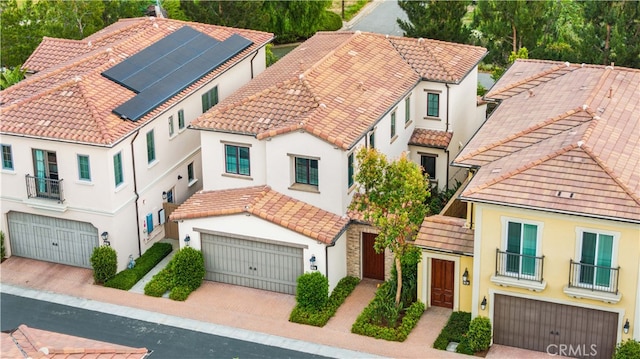 54 Painted Cameo, Irvine, CA 92602 - view of front of house featuring a balcony, an attached garage, and stucco siding