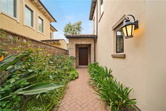 54 Painted Cameo, Irvine, CA 92602 - doorway to property featuring stucco siding and fence