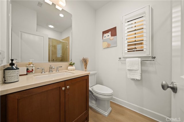 54 Painted Cameo, Irvine, CA 92602 - full bathroom featuring wood finished floors, a shower stall, baseboards, toilet, and vanity