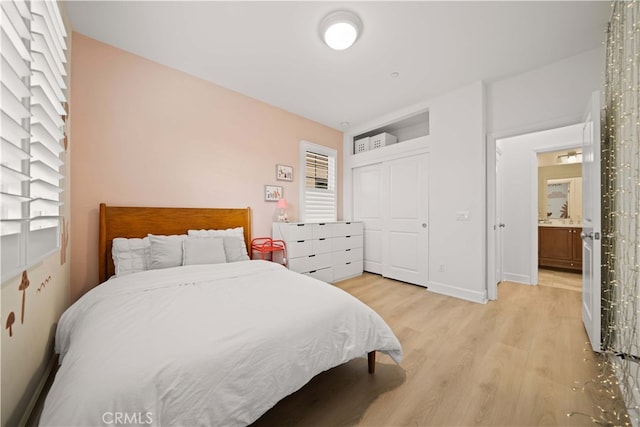54 Painted Cameo, Irvine, CA 92602 - bedroom with light wood-type flooring, a closet, and baseboards