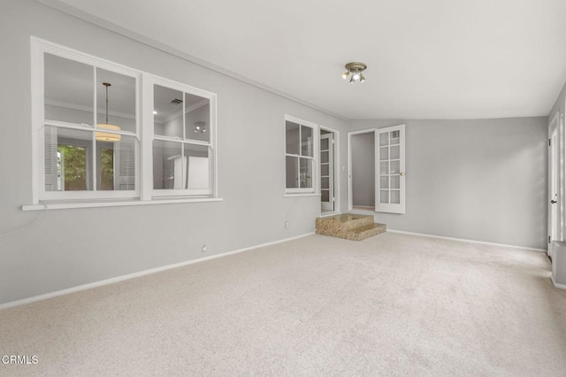 unfurnished room featuring baseboards and carpet floors