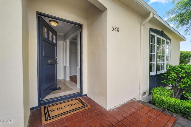 doorway to property with stucco siding