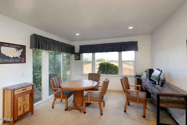 dining space featuring healthy amount of natural light, light colored carpet, recessed lighting, and an office area